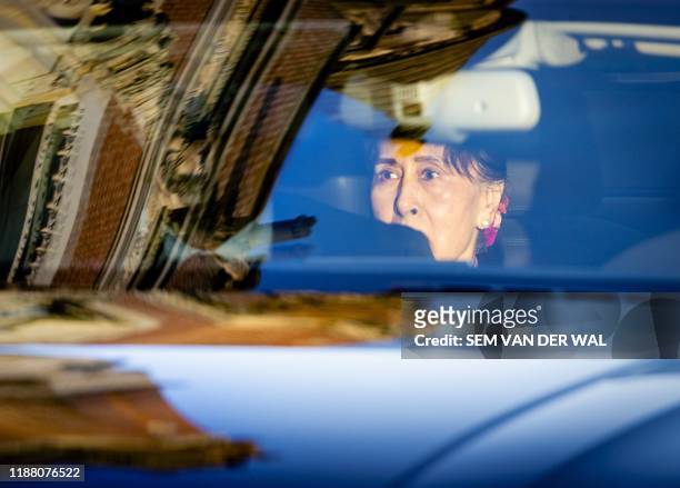 Myanmar's State Counsellor Aung San Suu Kyi arrives in a car on the last day of hearing on the Rohingya genocide case before the UN International...