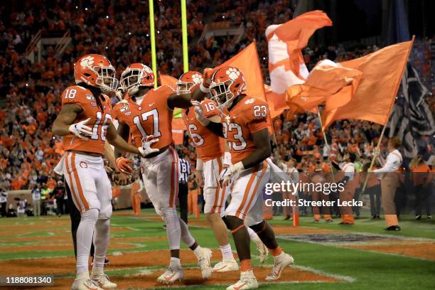 Lyn-J Dixon of the Clemson Tigers celebrates after running for a touchdown against the Wake Forest Demon Deacons during their game at Memorial...