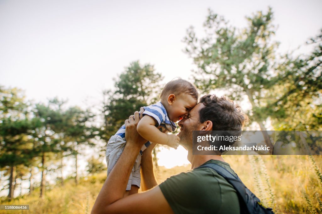 Baby boy with daddy in the nature