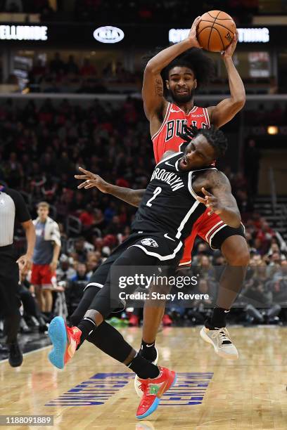 Coby White of the Chicago Bulls collides with Taurean Prince of the Brooklyn Nets during the first half of a game at United Center on November 16,...