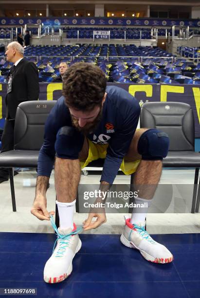 Luigi Datome, #70 of Fenerbahce Beko Istanbul ties his shoes with One Team turquoise shoelaces during the Turkish Airlines EuroLeague match between...