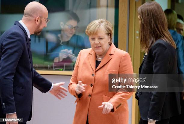 President of the European Council Charles Michel is talking with the German Chancellor Angela Merkel under the regards of the Belgium Prime Minister...