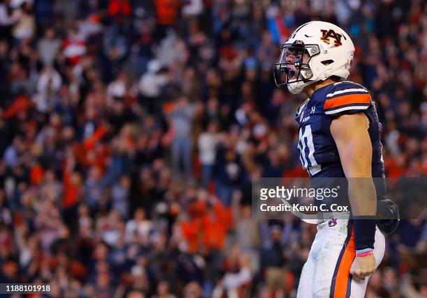 Bo Nix of the Auburn Tigers reacts after rushing for a touchdown in the second half against the Georgia Bulldogs at Jordan-Hare Stadium on November...