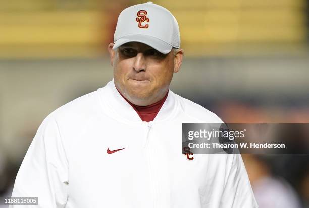 Head coach Clay Helton of the USC Trojans looks on while his team warms up prior to playing the California Golden Bears in an NCAA football game at...