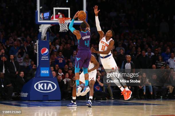 Devonte' Graham of the Charlotte Hornets hits a three point basket with 2 seconds left in the fourth quarter to win the game against the New York...