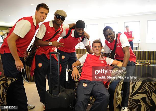 Wojciech Szczesny, Alex Song, Johan Djourou, Jack Wilshere and Emmanuel Frimpong of Arsenal wait to board a flight to Malaysia for the club's...