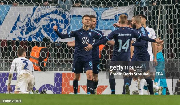 Arnor Ingvi Traustason of Malmo FF celebrates with team mates after scoring his team's first goal during the UEFA Europa League group B match between...