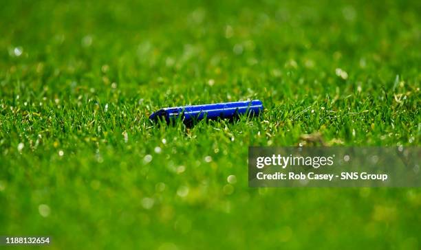 Lighters are thrown onto pitch during the Europa League Group G match between Rangers and BSC Young Boys at Ibrox Stadium on December 12, 2019 in...