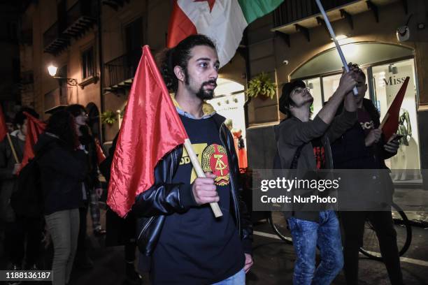 Members of the communist social centers and anarchist movements during an anti-fascist procession through the streets of Palermo. Palermo, Italy 12...