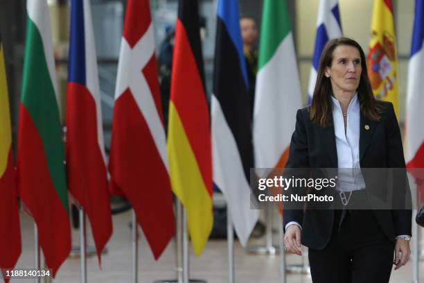 Sophie Wilmès Prime Minister of Belgium arriving at the European Council - Euro Summit - EU leaders meeting on the red carpet with the flags in the...