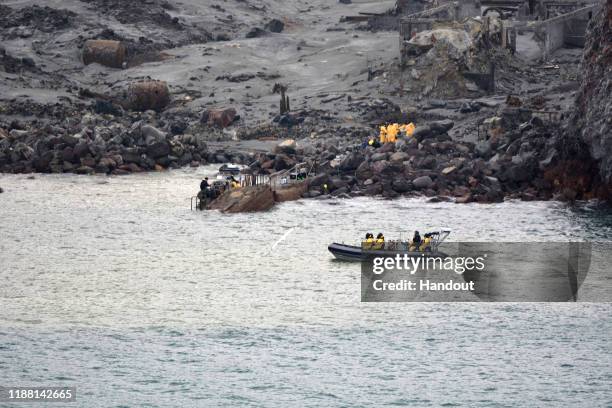 In this handout image provided by the New Zealand Defence Force, recovery operation at Whakaari/White Island on December 13, 2019 in Whakatane, New...