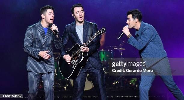 Joe Jonas, Kevin Jonas and Nick Jonas perform onstage during Jonas Brothers: "Happiness Begins" Tour at Amway Center on November 16, 2019 in Orlando,...