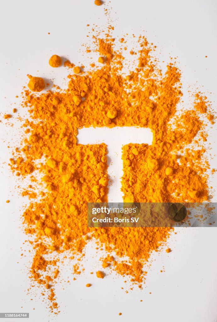 Turmeric Powerd forming letter T