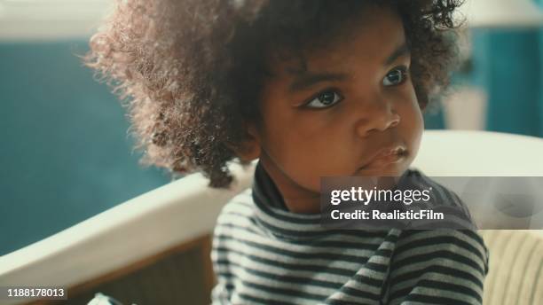 afro girl playing rotary phone - nigerian girls stock pictures, royalty-free photos & images