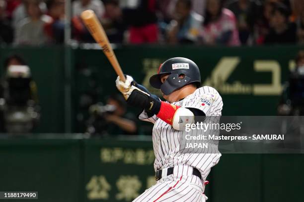 Infielder Tetsuto Yamada of Japan hits a three-run homer to make it 3-4 in the bottom of 2nd inning during the WBSC Premier 12 final game between...