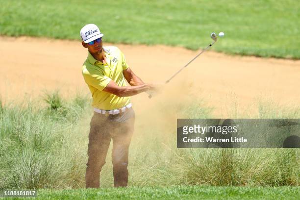 Rafa Cabrera Bello plays out from a bunker on the 14th hole during the fourth round of the Nedbank Golf Challenge hosted by Gary Player at the Gary...
