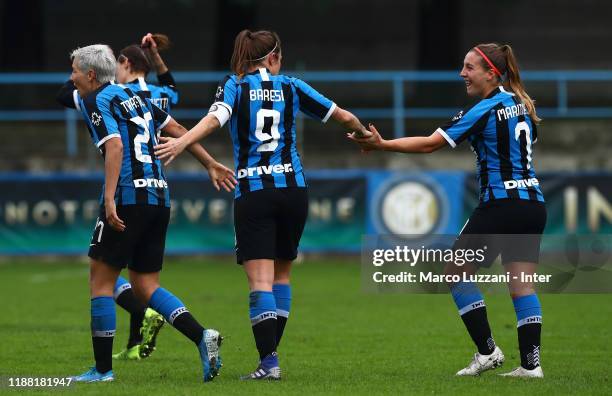 Regina Baresi of FC Internazionale celebrates with her team-mates Gloria Marinelli and Stefania Tarenzi after scoring the opening goal during the...