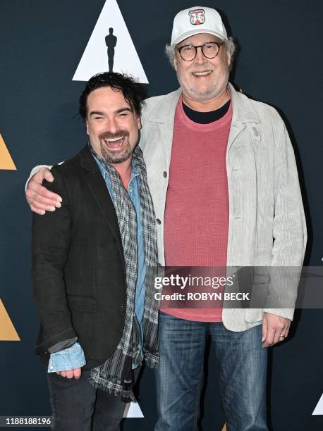 Actors Johnny Galecki and Chevy Chase attend the Academy of Motion Picture Arts and Sciences 30th anniversary screening of "National Lampoons...