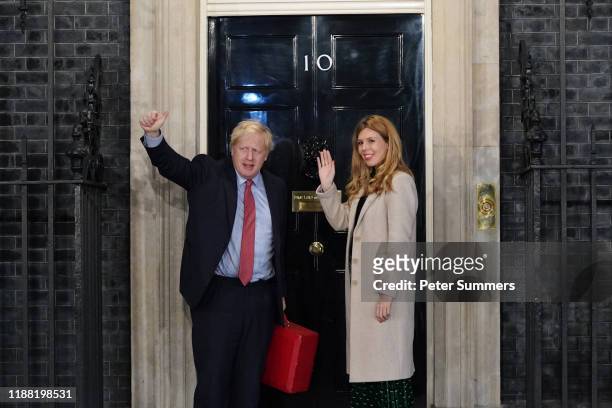 Prime Minister Boris Johnson and his partner Carrie Symonds enter Downing Street as the Conservatives celebrate a sweeping election victory on...