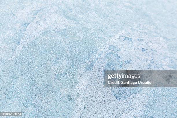 close-up of frosted car windshield - winter car window stock-fotos und bilder