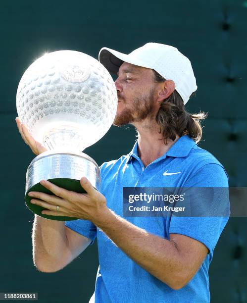 Tommy Fleetwood poses for a photo with the Nedbank Golf Challenge Trophy after victory during the fourth round of the Nedbank Golf Challenge hosted...