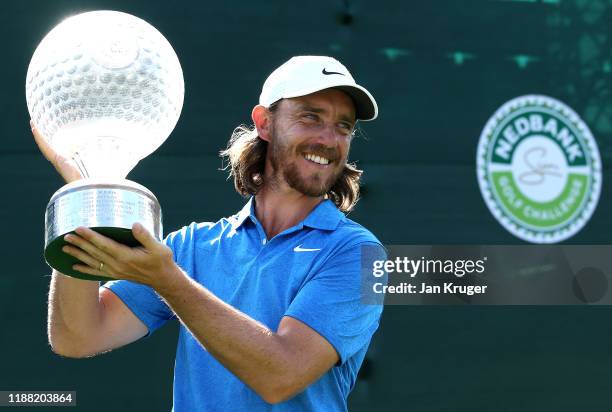 Tommy Fleetwood poses for a photo with the Nedbank Golf Challenge Trophy after victory during the fourth round of the Nedbank Golf Challenge hosted...