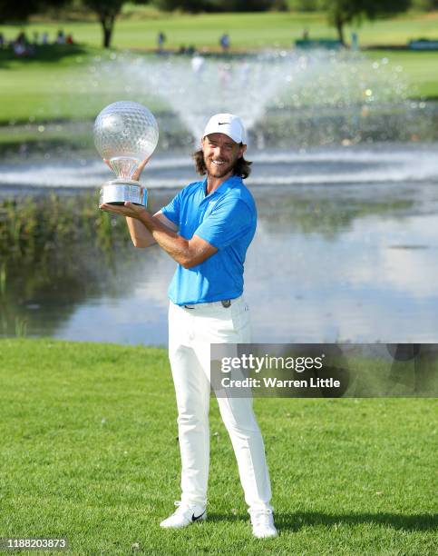 Tommy Fleetwood poses for a photo with the Nedbank Golf Challenge Trophy after victory during the fourth round of the Nedbank Golf Challenge hosted...