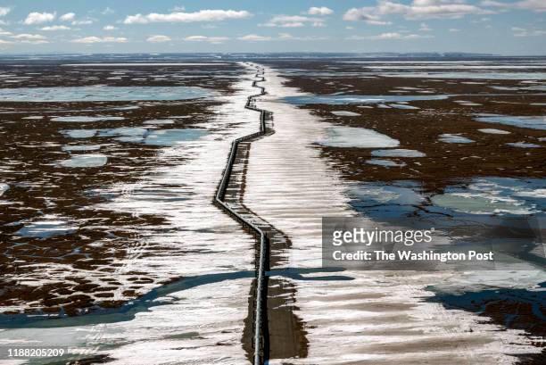 An oil pipeline stretches across the landscape outside Prudhoe Bay in North Slope Borough, AK on May 25, 2019.