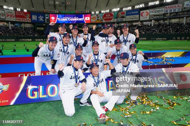 Japanese pitching staffs pose after the WBSC Premier 12 final game between Japan and South Korea at the Tokyo Dome on November 17, 2019 in Tokyo,...