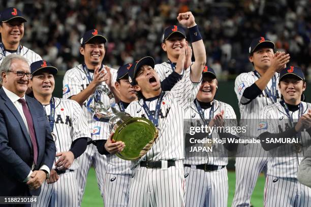 Infielder Nobuhiro Matsuda of Japan celebrates after receiving the WBSC Premier 12 trophy at the ceremony following the WBSC Premier 12 final game...