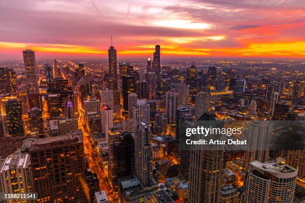 beautiful sunset over the chicago downtown with skyscrapers and horizon. - chicago dusk stock pictures, royalty-free photos & images