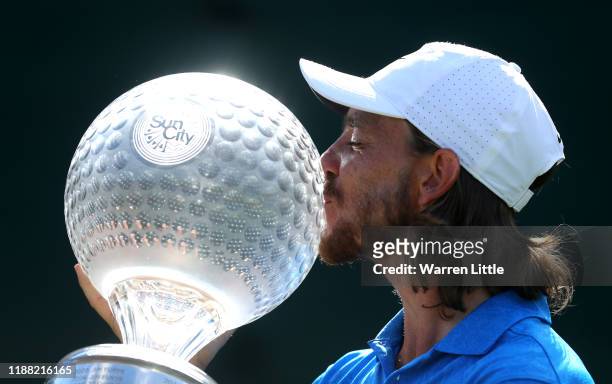 Tommy Fleetwood of England poses with the trophy after winning the Nedbank Golf Challenge hosted by Gary Player at the Gary Player CC on November 17,...