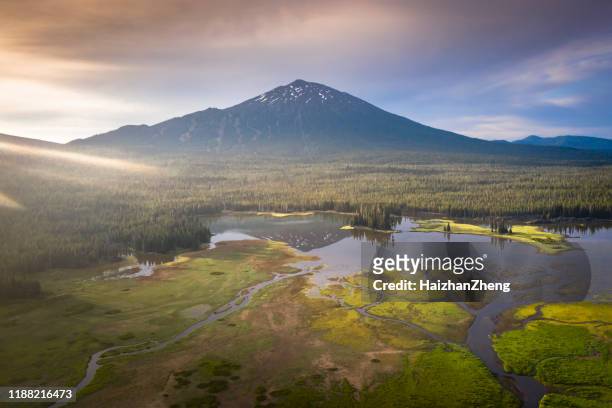 saturated color lake near mt. bachelor oregon cascade range - mt bachelor stock pictures, royalty-free photos & images