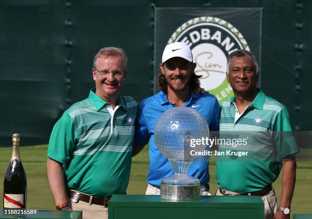 Tommy Fleetwood of England poses with Mike Brown, CEO Nedbank and Vassi Naidoo, Chairman of Nedbank after the final round of the Nedbank Golf...