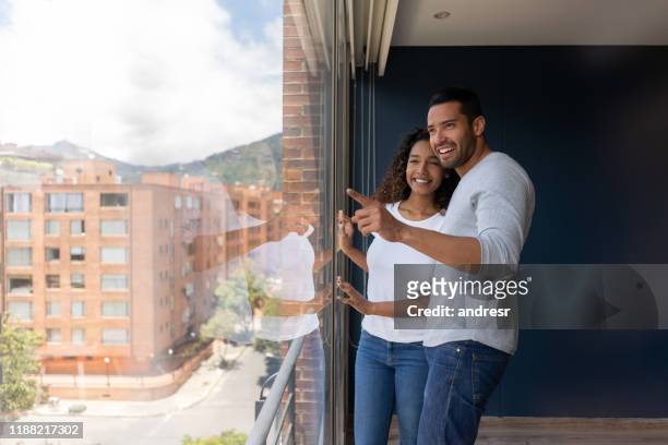 couple looking at the view at a flat to let - buy to let stock pictures, royalty-free photos & images