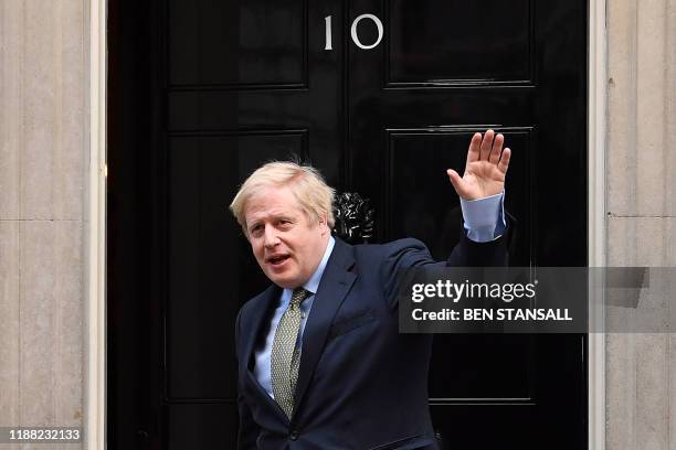 Britain's Prime Minister and Conservative Party leader Boris Johnson arrives at 10 Downing Street in central London on December 13 following an...