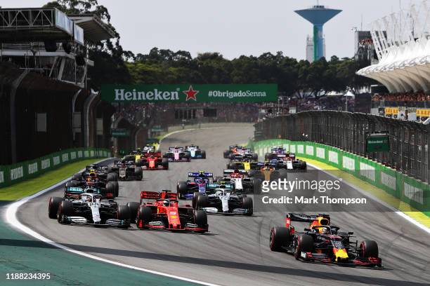 Max Verstappen of the Netherlands driving the Aston Martin Red Bull Racing RB15 leads the field into turn one at the start during the F1 Grand Prix...