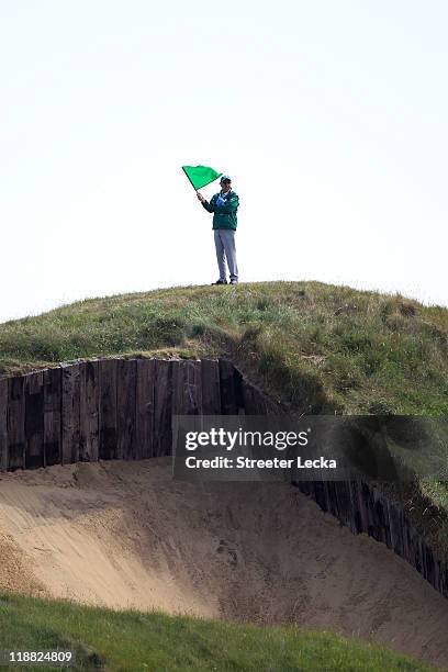 Marshal is seen during the first practice round during The Open Championship, at Royal St. George's on July 11, 2011 in Sandwich, England. The 140th...