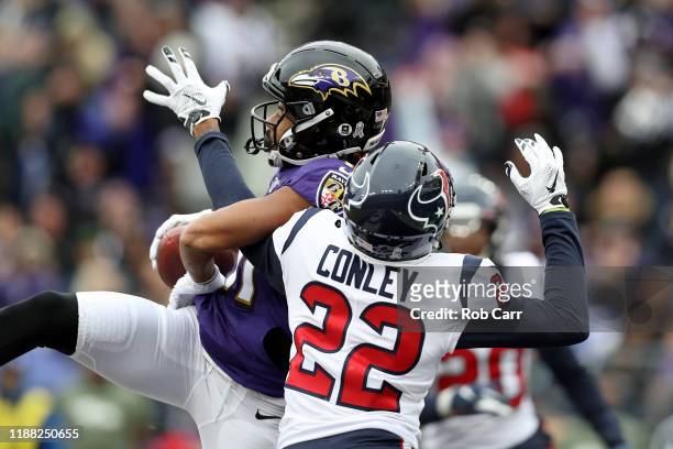 Seth Roberts of the Baltimore Ravens catches a 15 yard touchdown pass from Lamar Jackson against Gareon Conley of the Houston Texans during the...