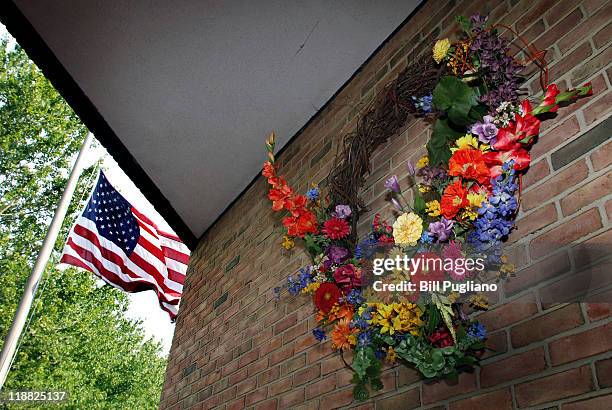 Flag flies at half-staff next a memorial wreath in honor of former first lady Betty Ford at the Gerald R. Ford Presidential Library July 11, 2011 in...