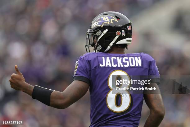 Quarterback Lamar Jackson of the Baltimore Ravens reacts with a thumbs-up against the Houston Texans during the second quarter at M&T Bank Stadium on...