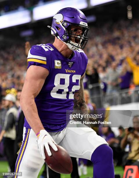 Kyle Rudolph of the Minnesota Vikings celebrates a touchdown pass reception against the Denver Broncos in the fourth quarter at U.S. Bank Stadium on...