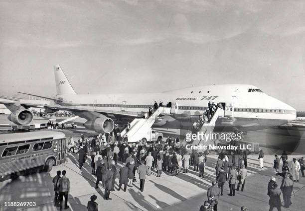 Passengers disembark from the giant Pan American Boeing 747 airplane after it arrived at Hangar 17 at JFK Airport in Jamaica, New York on December 2,...