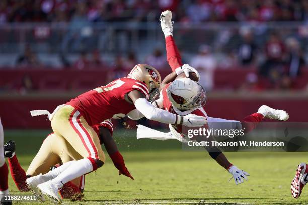 Running back Kenyan Drake of the Arizona Cardinals is tackled as he rushes the football against the San Francisco 49ers during the first half of the...