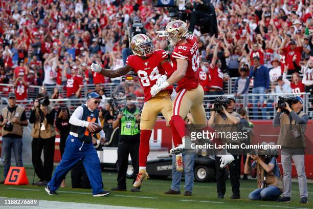 Tight end Ross Dwelley of the San Francisco 49ers celebrates with Kendrick Bourne after scoring a four yard touchdown reception against the Arizona...