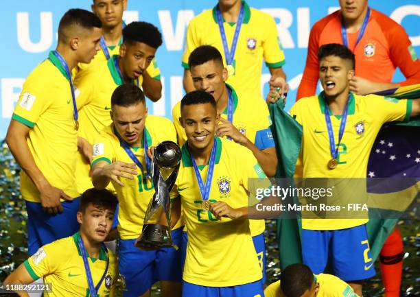 Lazaro of Brazil celebrates with the World Cup Trophy during the Final of the FIFA U-17 World Cup Brazil 2019 between Mexico and Brazil at the...