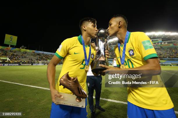 Kaio Jorge of Brazil and Lazaro of Brazil celebrate with the trophy during the Final of the FIFA U-17 World Cup Brazil 2019 between Mexico and Brazil...