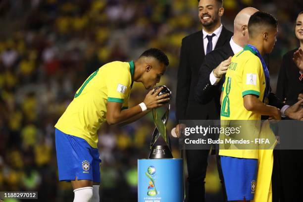 Lazaro of Brazil kisses the trophy during the Final of the FIFA U-17 World Cup Brazil 2019 between Mexico and Brazil at the Estadio Bezerrão on...