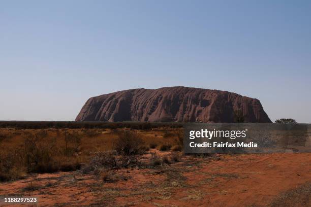 The sun sets on Uluru in the Northern Territory on the day the tourist walking track to the summit was permanently closed, October 25, 2019. The...