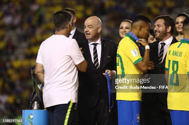 Guilherme Dalla Dea, Coach of Brazil shakes hands with Gianni Infantino, President of FIFA during the Final of the FIFA U-17 World Cup Brazil 2019...